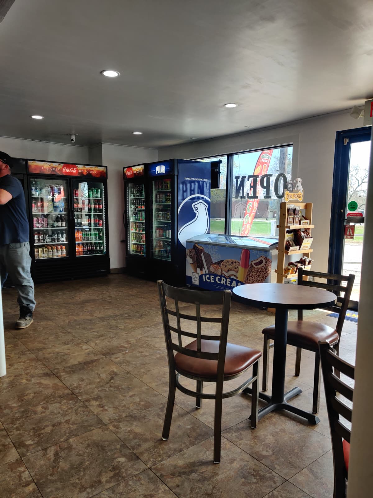 Cold drink coolers, ice cream, and seating area at Maui's